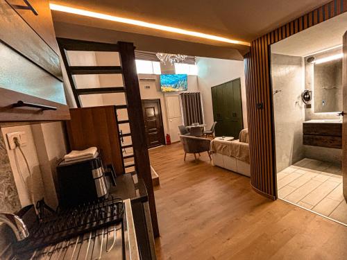 a room with a bunk bed and a living room at Studio Centro - Luxury Apartment at Pylos Center in Pylos