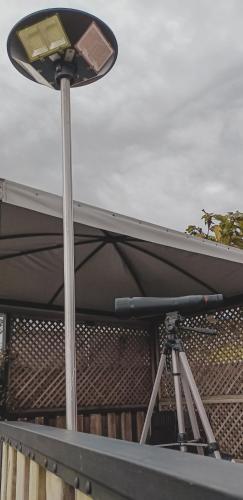 a street light on top of a building with a camera at La Isabela Glamping in Marinilla