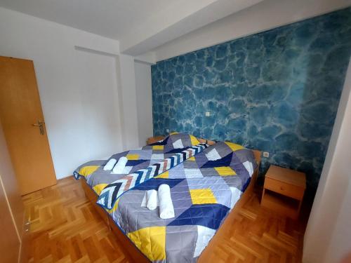 Un pat sau paturi într-o cameră la Ana Apartment