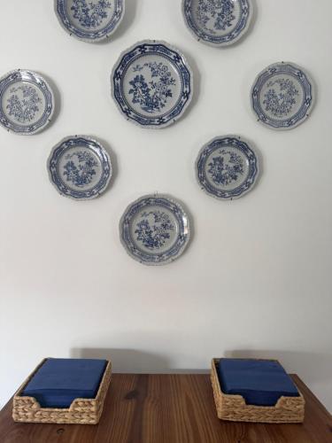 a wall with blue and white plates on a wall at Casa Anna in Venice