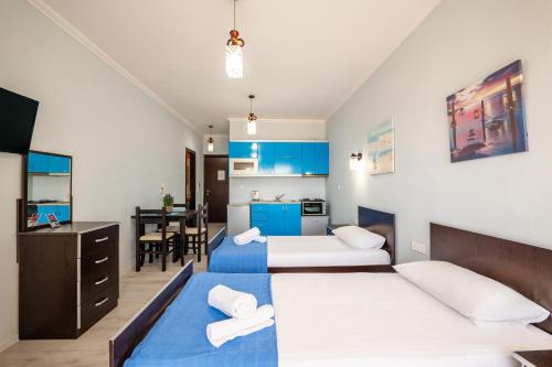 Ένα ή περισσότερα κρεβάτια σε δωμάτιο στο Keos Hotel