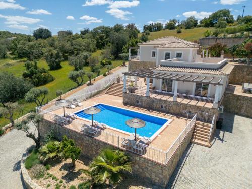 an aerial view of a villa with a swimming pool at Casa Quadra Dique in Faro