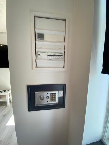 a wall mounted radio in a white wall at AdelgadeHuset in Bogense