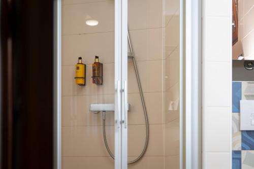 a shower with a hose in a bathroom at Villa Nauta in Lovište