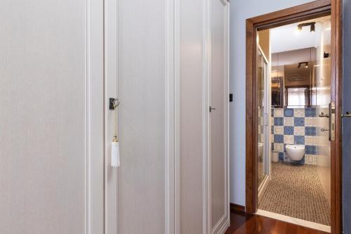 a bathroom with a door leading to a toilet at Villa Nauta in Lovište