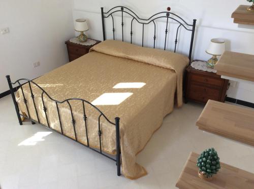 Ένα ή περισσότερα κρεβάτια σε δωμάτιο στο Casa Camelia