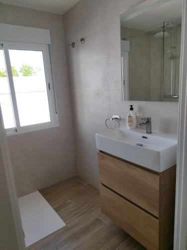 a bathroom with a sink and a mirror at La Casita de Isabel, Near Ronda, Sierra de Grazalema in Montecorto