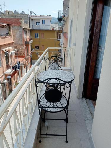a wrought iron table on a balcony on a building at Casa Karmel in Campofelice di Roccella