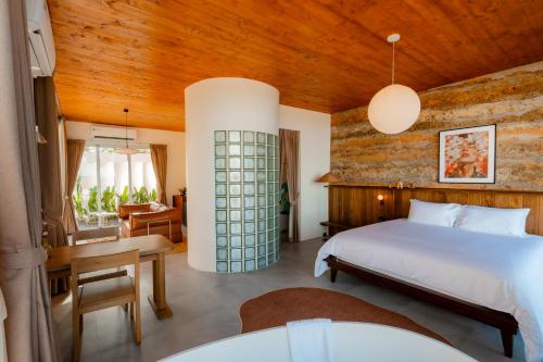 Postel nebo postele na pokoji v ubytování Furusato Shack Pranburi ฟูรุซาโตะ แชค ปราณบุรี ふるさとシャック