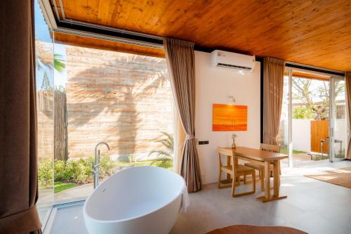 Posezení v ubytování Furusato Shack Pranburi ฟูรุซาโตะ แชค ปราณบุรี ふるさとシャック