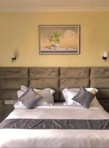 Postel nebo postele na pokoji v ubytování Calian hotel