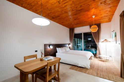 Postel nebo postele na pokoji v ubytování Furusato Shack Pranburi ฟูรุซาโตะ แชค ปราณบุรี ふるさとシャック