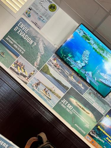 Телевизор и/или развлекательный центр в Appartement avec superbe VUE MER Pierre et Vacances Sainte-Anne Guadeloupe OCEAN LILI's EYES