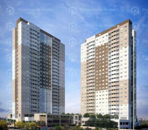a rendering of two tall buildings in a city at Apto 2dormitórios Empresa família CentroBrás in Sao Paulo