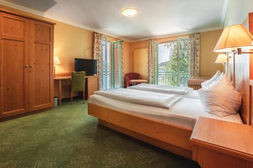 Postel nebo postele na pokoji v ubytování Hotel Seerose