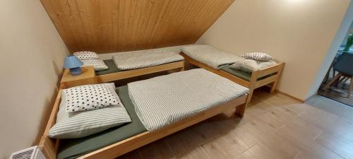 a room with three bunk beds in it at Tygiel Krzywa, Beskid Niski in Krzywa
