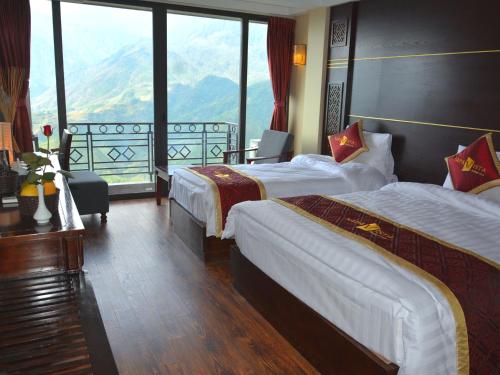 Ένα ή περισσότερα κρεβάτια σε δωμάτιο στο Sapa Vista Hotel
