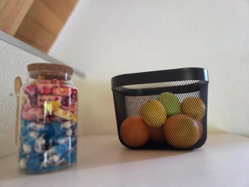 a container of candies next to a jar of candy at Villa Tea in Šipovo