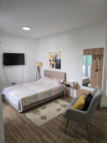 Postel nebo postele na pokoji v ubytování Kmb Apartment