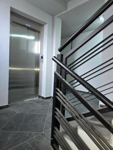 a elevator in a building with a metal door at Kmb Apartment in Kragujevac