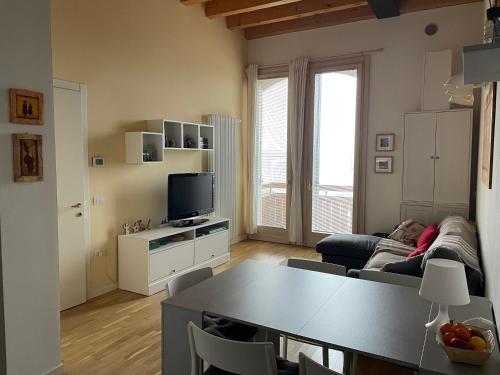 a living room with a couch and a table at La baita di Niki in Tonezza del Cimone