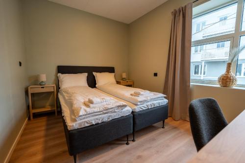 Postel nebo postele na pokoji v ubytování Arken hotell Kopervik