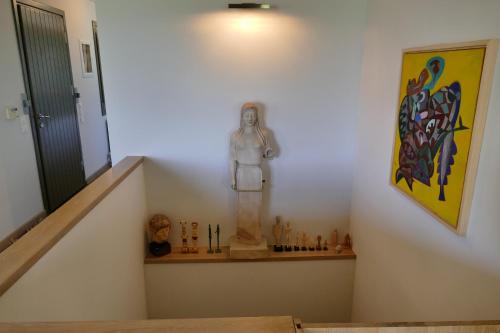 a stairway with a statue of an astronaut on a shelf at Art Villa Pelion in Agria