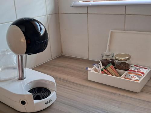 a blender on a counter next to a box of food at Bandile's cosy home in Honeydew