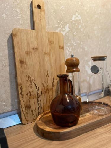 a vase sitting on top of a wooden table at Dor de rădăcini in Nemţişor