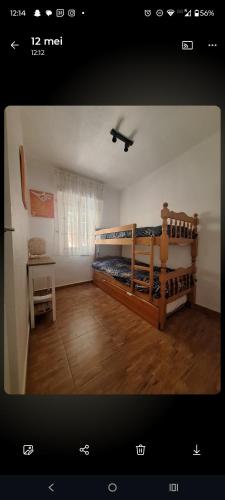 a bedroom with two bunk beds and a desk at Tranquilo Townhouse Casa Spain Kwintos in Torrevieja