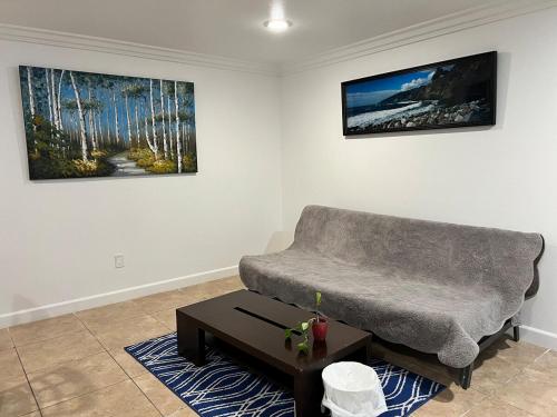 a living room with a couch and a coffee table at Near Disney,college,sunset beach ,airport in Norwalk