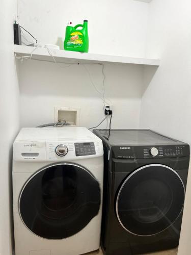 a black and white washing machine in a room at Near Disney,college,sunset beach ,airport in Norwalk