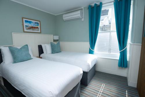 The Clarendon Hotelにあるベッド