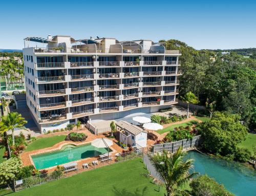 an aerial view of a hotel with a swimming pool at Sails Resort Caloundra in Golden Beach