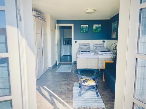 a room with a bed and a table in it at Rørvig Bed & Kitchen in Rørvig