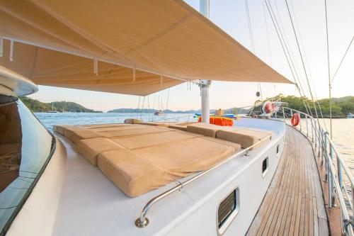 a boat with a bed on the side of it at Gulet for rent in Göcek - 24 Mt 6 Cabins 12 Guest in Eskiömerler