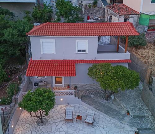 a model of a house with a red roof at Ellovos, View from Above in Samos