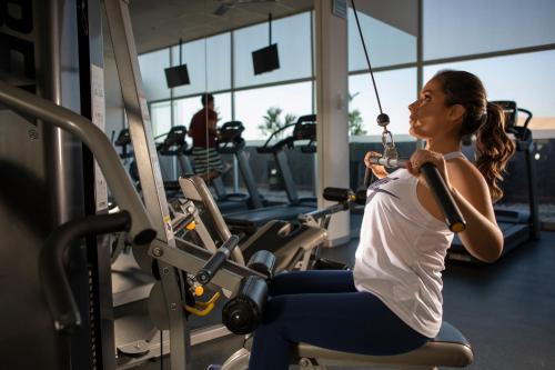 a woman sitting in a gym while swinging at Casa Andina Select Tacna in Tacna