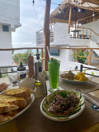 a table with two plates of food on it at Posada Restaurant La Guaricha in Catia La Mar