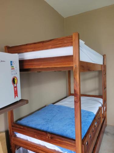 a couple of bunk beds in a room at Pousada Flor do Café in Ubajara