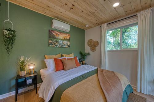 a bedroom with a bed and a window at The Mountains are Calling - Private, Guesthouse Retreat near Yosemite in Ahwahnee