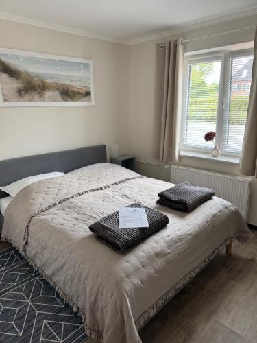 En eller flere senge i et værelse på Medelby Inn