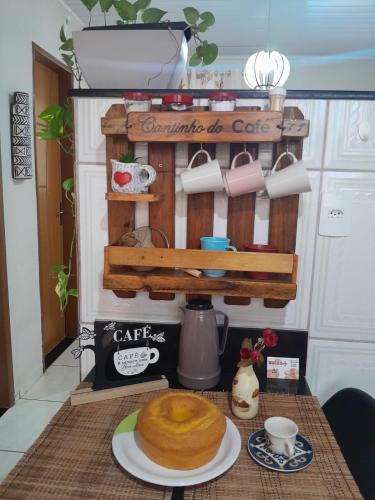 a table with a cake on top of it at Apartamento elegante a 1km do centro de Aracruz wifi gratuito garagem hacht cozinha equipada totamente individual in Aracruz