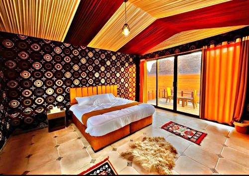 Ένα ή περισσότερα κρεβάτια σε δωμάτιο στο CAPITAL RUM lUXURY CAMP