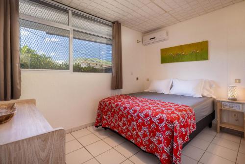 Una cama o camas en una habitación de Fare Kenzo 1