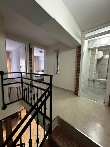 a staircase leading to a room with a glass door at Cozy & Accessible Home, Just Like Yours! in Golem