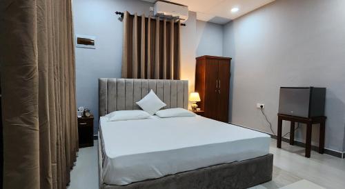 Una cama o camas en una habitación de Fairfield Villa Colombo