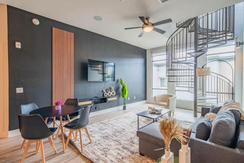 a living room with a couch and a table at Private Rooftop, Kierland Commons, TPC Golf, Pool, Gym in Scottsdale