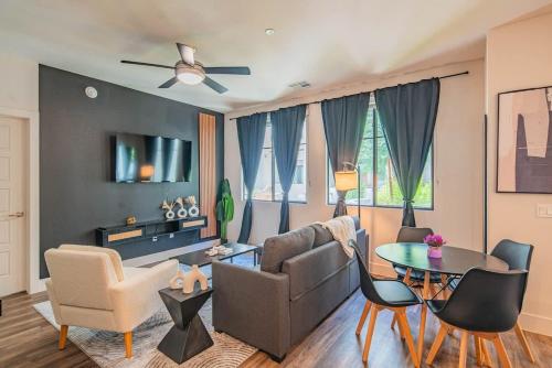 a living room with a couch and a table at Modern 1BR Kierland Commons, TPC Golf, Pool, Gym, W-D in Scottsdale