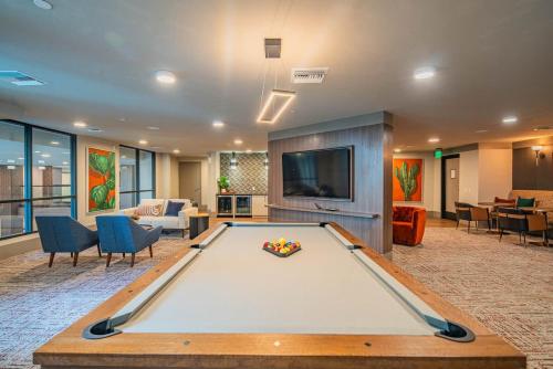 a pool table in a room with a living room at Peaceful 1BR Kierland Common, TPC Golf, Pool, Gym, W-D in Scottsdale